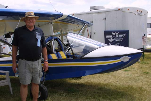 Wayne Richter of Progressive Aerodyne beside a recently completed SeaRey 