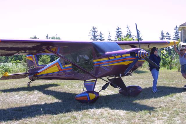 Lisa Volk builder, owner and pilot, beside her award winning Murphy Rebel.